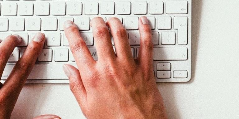 Hands on computer keyboard 