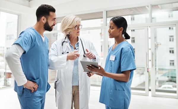 A group of medical practitioners having a discussion in a hospital