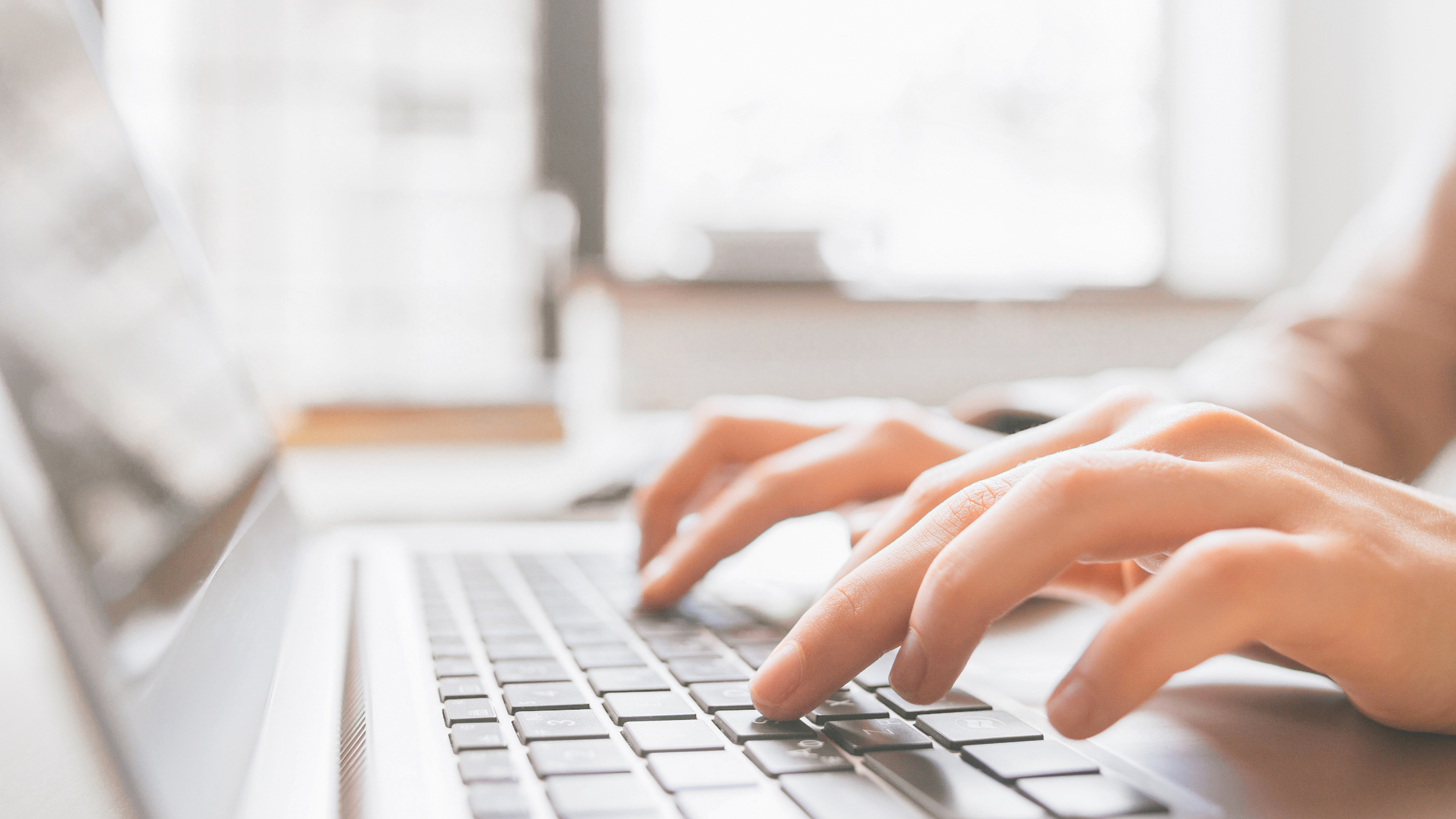A person typing on a computer.