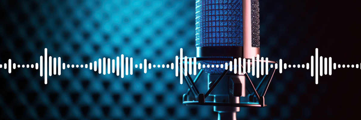 Microphone standing on table with white sound wave lines superimposed. Background colours are blue and black.